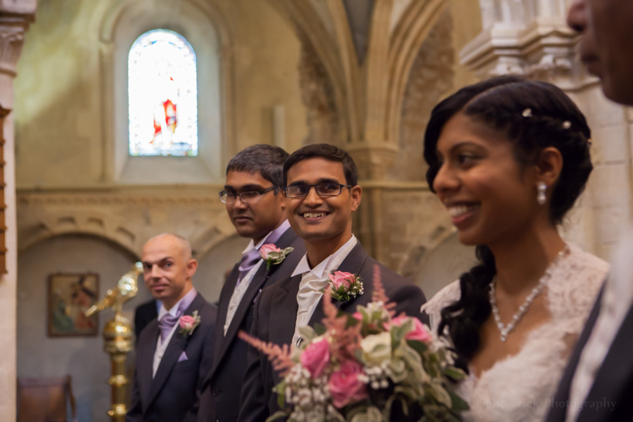 smiling grooms sees bride for the first time